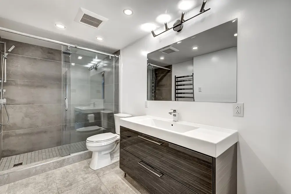 Bathroom Ventilation in Kent’s Climate: The Fan Sizing We Use and Why 50 CFM Isn’t Enough
