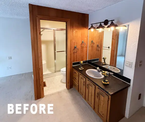 Bathroom before remodel with dark oak vanity and brass fixtures